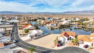Rare 58-foot-wide waterfront lot on the middle lake in the on Los Lagos Golf Club in Arizona - for sale on GolfHomes.com, golf home, golf lot