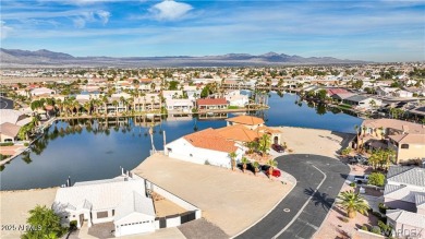 Rare 58-foot-wide waterfront lot on the middle lake in the on Los Lagos Golf Club in Arizona - for sale on GolfHomes.com, golf home, golf lot
