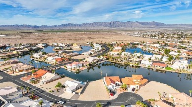 Rare 58-foot-wide waterfront lot on the middle lake in the on Los Lagos Golf Club in Arizona - for sale on GolfHomes.com, golf home, golf lot