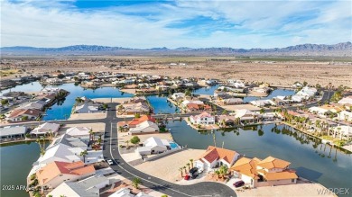 Rare 58-foot-wide waterfront lot on the middle lake in the on Los Lagos Golf Club in Arizona - for sale on GolfHomes.com, golf home, golf lot