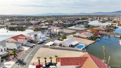 Rare 58-foot-wide waterfront lot on the middle lake in the on Los Lagos Golf Club in Arizona - for sale on GolfHomes.com, golf home, golf lot