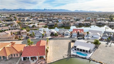 Rare 58-foot-wide waterfront lot on the middle lake in the on Los Lagos Golf Club in Arizona - for sale on GolfHomes.com, golf home, golf lot
