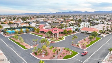 Rare 58-foot-wide waterfront lot on the middle lake in the on Los Lagos Golf Club in Arizona - for sale on GolfHomes.com, golf home, golf lot