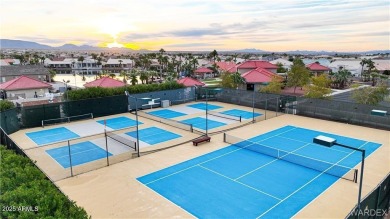 Rare 58-foot-wide waterfront lot on the middle lake in the on Los Lagos Golf Club in Arizona - for sale on GolfHomes.com, golf home, golf lot