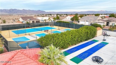 Rare 58-foot-wide waterfront lot on the middle lake in the on Los Lagos Golf Club in Arizona - for sale on GolfHomes.com, golf home, golf lot