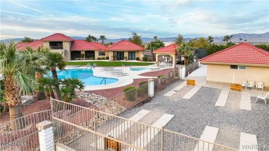 Rare 58-foot-wide waterfront lot on the middle lake in the on Los Lagos Golf Club in Arizona - for sale on GolfHomes.com, golf home, golf lot