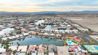 Rare 58-foot-wide waterfront lot on the middle lake in the on Los Lagos Golf Club in Arizona - for sale on GolfHomes.com, golf home, golf lot