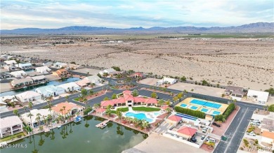 Rare 58-foot-wide waterfront lot on the middle lake in the on Los Lagos Golf Club in Arizona - for sale on GolfHomes.com, golf home, golf lot