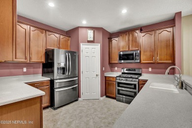 Wonderfully maintained 4 bedroom, 2 & 1/2 bathroom home situated on St. Johns Golf and Country Club in Florida - for sale on GolfHomes.com, golf home, golf lot