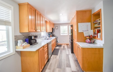 Beautifully updated 3 bedroom, 2.5 bath home offering both on Quincy Golf Course in Michigan - for sale on GolfHomes.com, golf home, golf lot