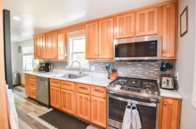 Beautifully updated 3 bedroom, 2.5 bath home offering both on Quincy Golf Course in Michigan - for sale on GolfHomes.com, golf home, golf lot