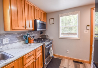 Beautifully updated 3 bedroom, 2.5 bath home offering both on Quincy Golf Course in Michigan - for sale on GolfHomes.com, golf home, golf lot