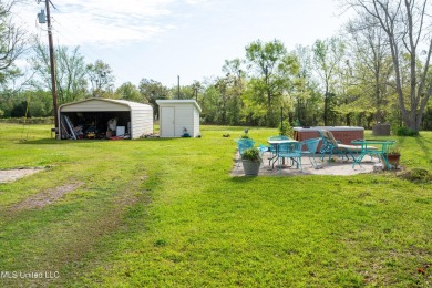 This could be your serene waterfront life! Live comfortably in on Pass Christian Isles Golf Club in Mississippi - for sale on GolfHomes.com, golf home, golf lot