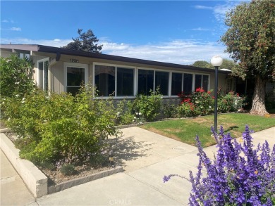 Gorgeous corner drive-up unit adorned with lovely exterior tile on Leisure World Seal Beach Golf Course in California - for sale on GolfHomes.com, golf home, golf lot