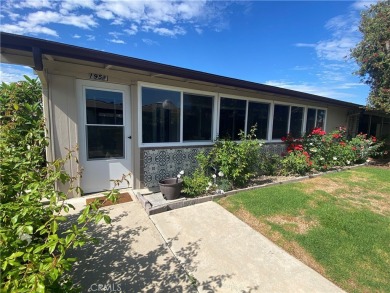 Gorgeous corner drive-up unit adorned with lovely exterior tile on Leisure World Seal Beach Golf Course in California - for sale on GolfHomes.com, golf home, golf lot