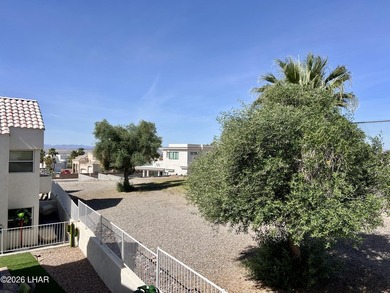 Enjoy golf course living in this second-floor condo overlooking on London Bridge Golf Course in Arizona - for sale on GolfHomes.com, golf home, golf lot
