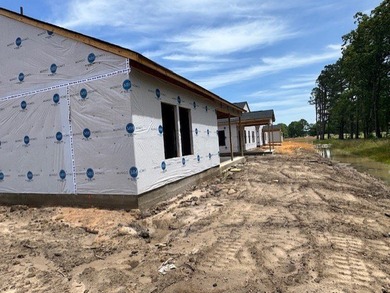 Your spacious cottage awaits in the Gwinnett C Floorplan. This on Players Course At Wyboo Plantation in South Carolina - for sale on GolfHomes.com, golf home, golf lot