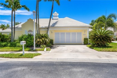 Lovely bright light waterfront villa, with enclosed porch plus on Oak Harbor Country Club in Florida - for sale on GolfHomes.com, golf home, golf lot