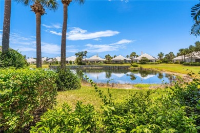 Lovely bright light waterfront villa, with enclosed porch plus on Oak Harbor Country Club in Florida - for sale on GolfHomes.com, golf home, golf lot