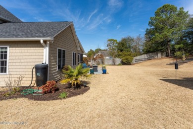 This home is instantly appealing and very well maintained. It on Beau Rivage Golf and Resort in North Carolina - for sale on GolfHomes.com, golf home, golf lot