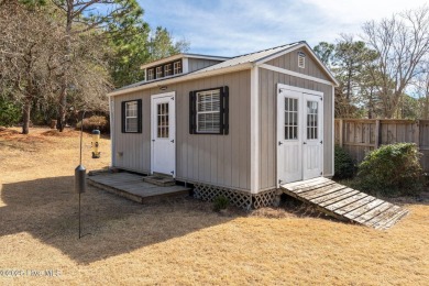 This home is instantly appealing and very well maintained. It on Beau Rivage Golf and Resort in North Carolina - for sale on GolfHomes.com, golf home, golf lot