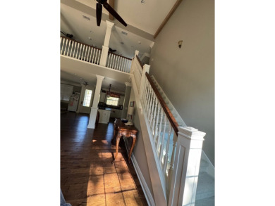 This beautiful 2 story home in Bailey's Bluff isa golf cart ride on Cypress Bend Golf Resort in Louisiana - for sale on GolfHomes.com, golf home, golf lot