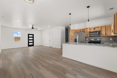 Welcome to 133 Chamartin, a stunning custom home ideally located on Tierra Del Sol Golf Course in New Mexico - for sale on GolfHomes.com, golf home, golf lot