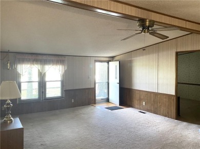 This 3 bedroom, 2 bathroom ranch home is priced to sell. It is on Linn Valley Lakes - Deer Trace Golf Course in Kansas - for sale on GolfHomes.com, golf home, golf lot