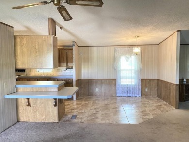 This 3 bedroom, 2 bathroom ranch home is priced to sell. It is on Linn Valley Lakes - Deer Trace Golf Course in Kansas - for sale on GolfHomes.com, golf home, golf lot