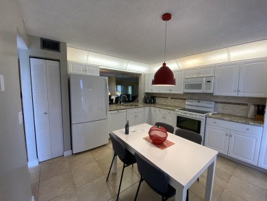 Beautiful unit with relaxing view from screen porch ready for on Indian Spring Golf and Country Club in Florida - for sale on GolfHomes.com, golf home, golf lot