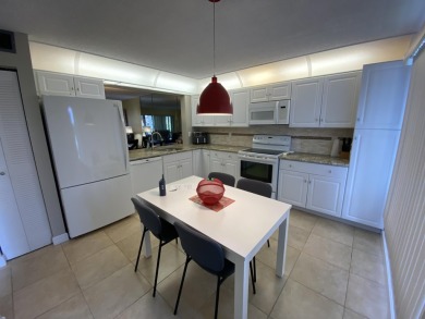 Beautiful unit with relaxing view from screen porch ready for on Indian Spring Golf and Country Club in Florida - for sale on GolfHomes.com, golf home, golf lot