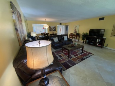 Beautiful unit with relaxing view from screen porch ready for on Indian Spring Golf and Country Club in Florida - for sale on GolfHomes.com, golf home, golf lot