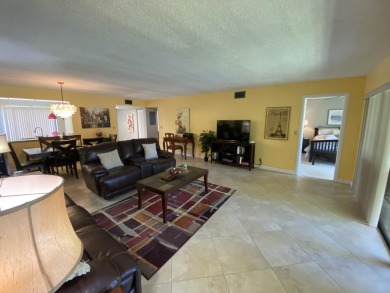 Beautiful unit with relaxing view from screen porch ready for on Indian Spring Golf and Country Club in Florida - for sale on GolfHomes.com, golf home, golf lot