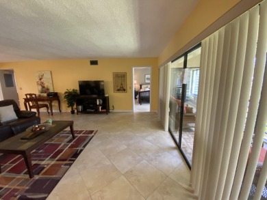 Beautiful unit with relaxing view from screen porch ready for on Indian Spring Golf and Country Club in Florida - for sale on GolfHomes.com, golf home, golf lot