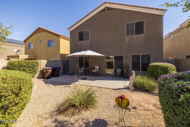 This expansive home overlooks the 9th hole of the golf course on Oasis Golf Club in Arizona - for sale on GolfHomes.com, golf home, golf lot