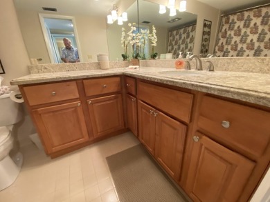 Beautiful unit with relaxing view from screen porch ready for on Indian Spring Golf and Country Club in Florida - for sale on GolfHomes.com, golf home, golf lot