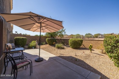 This expansive home overlooks the 9th hole of the golf course on Oasis Golf Club in Arizona - for sale on GolfHomes.com, golf home, golf lot