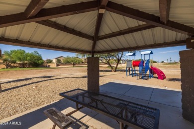 This expansive home overlooks the 9th hole of the golf course on Oasis Golf Club in Arizona - for sale on GolfHomes.com, golf home, golf lot