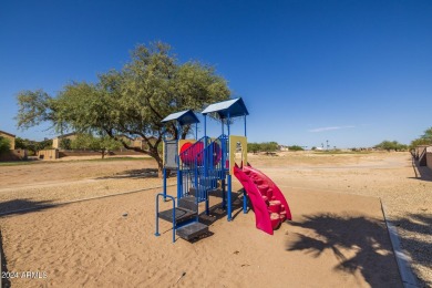 This expansive home overlooks the 9th hole of the golf course on Oasis Golf Club in Arizona - for sale on GolfHomes.com, golf home, golf lot