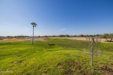 This expansive home overlooks the 9th hole of the golf course on Oasis Golf Club in Arizona - for sale on GolfHomes.com, golf home, golf lot