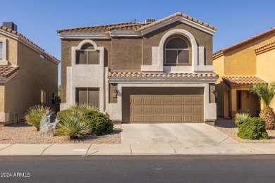 This expansive home overlooks the 9th hole of the golf course on Oasis Golf Club in Arizona - for sale on GolfHomes.com, golf home, golf lot