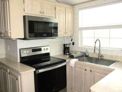 Welcome to your new DREAM HOME, located at 205 Arnold Palmer Dr on Deer Creek RV Golf Resort in Florida - for sale on GolfHomes.com, golf home, golf lot