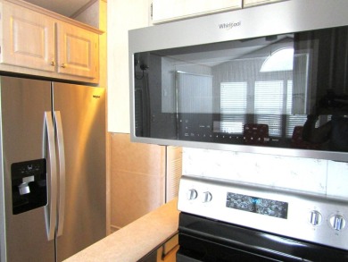 Welcome to your new DREAM HOME, located at 205 Arnold Palmer Dr on Deer Creek RV Golf Resort in Florida - for sale on GolfHomes.com, golf home, golf lot