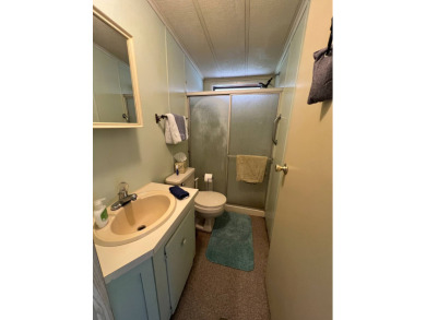 Cozy furnished home with no rear neighbors, ready for you to on Lake Henry Golf Club in Florida - for sale on GolfHomes.com, golf home, golf lot