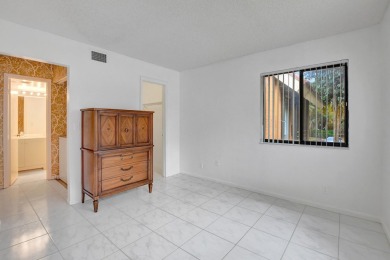 Discover this beautifully updated 2-bedroom, 2-bath condo on Indian Spring Golf and Country Club in Florida - for sale on GolfHomes.com, golf home, golf lot