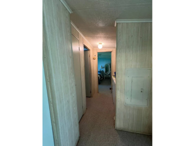 Cozy furnished home with no rear neighbors, ready for you to on Lake Henry Golf Club in Florida - for sale on GolfHomes.com, golf home, golf lot