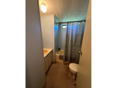 Cozy furnished home with no rear neighbors, ready for you to on Lake Henry Golf Club in Florida - for sale on GolfHomes.com, golf home, golf lot