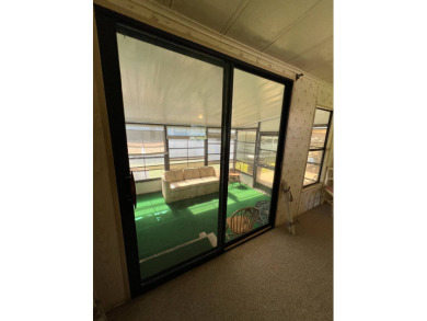Cozy furnished home with no rear neighbors, ready for you to on Lake Henry Golf Club in Florida - for sale on GolfHomes.com, golf home, golf lot