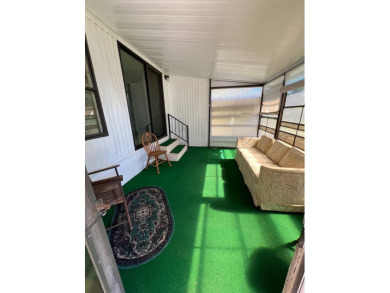 Cozy furnished home with no rear neighbors, ready for you to on Lake Henry Golf Club in Florida - for sale on GolfHomes.com, golf home, golf lot