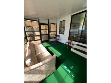 Cozy furnished home with no rear neighbors, ready for you to on Lake Henry Golf Club in Florida - for sale on GolfHomes.com, golf home, golf lot